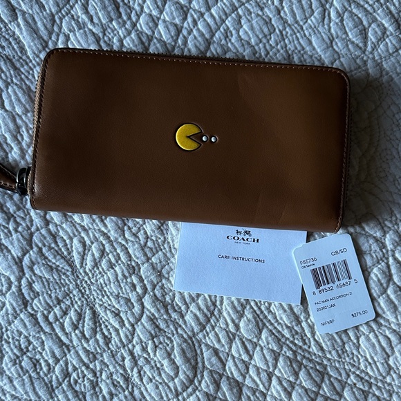 Coach Handbags - Coach saddle Brown Wallet with Yellow Pac-Man Motif